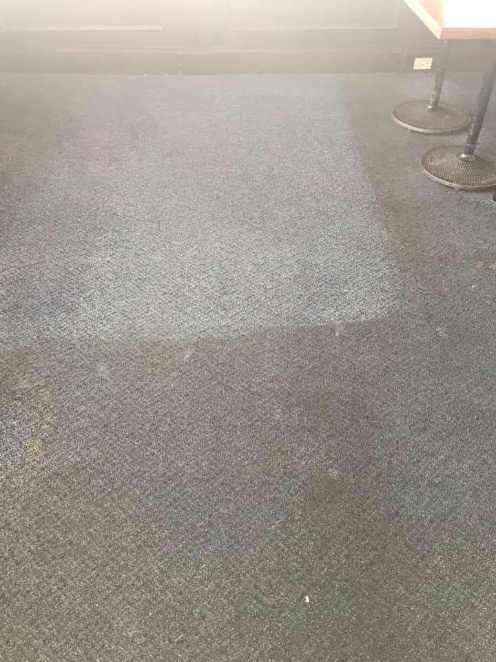 Commercial carpet being cleaned in an office